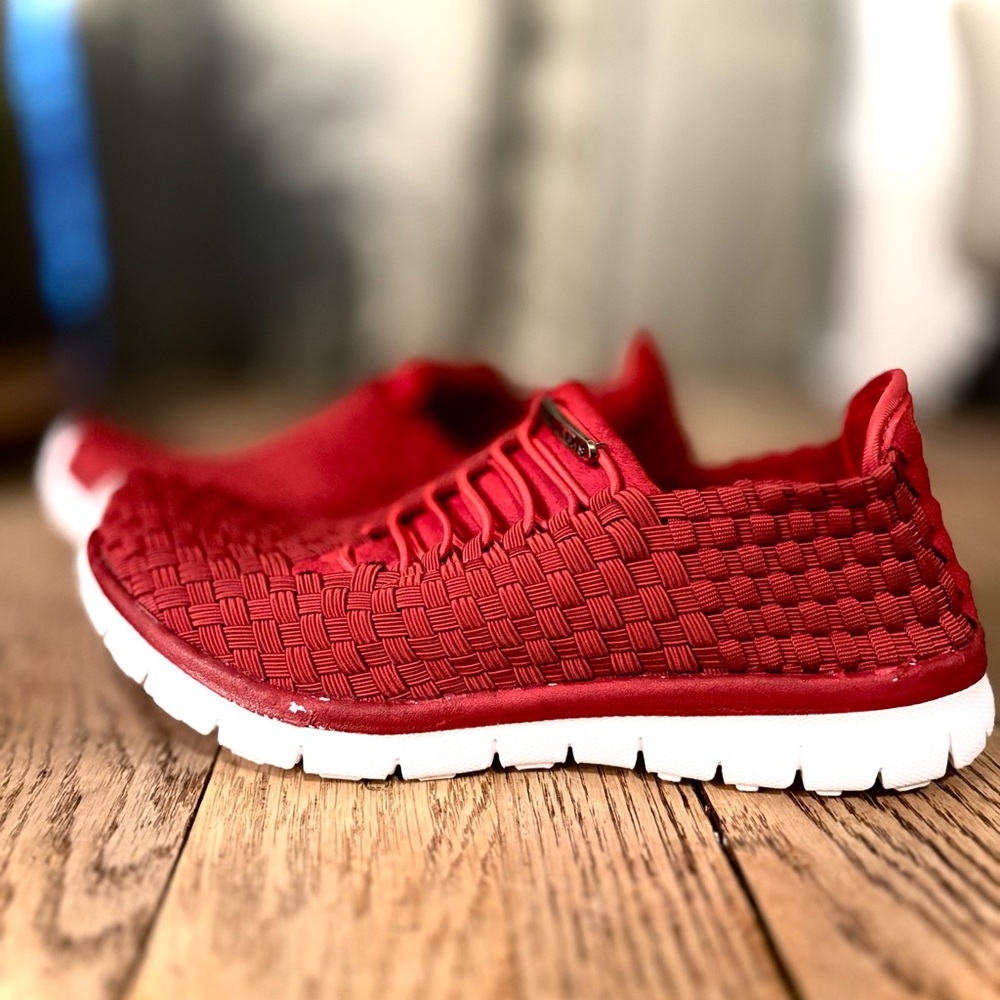 Red slip on running shoes. Size 7